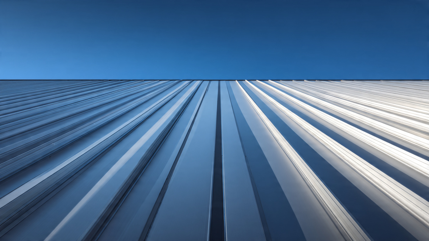 Close-up of standing seam metal roof panels highlighting clean, precise seams.